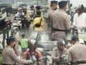 Cegah Dampak Kabut Asap Karhutla, Brimob Kalbar dan Aliansi Ojol Bagikan Masker di Pontianak